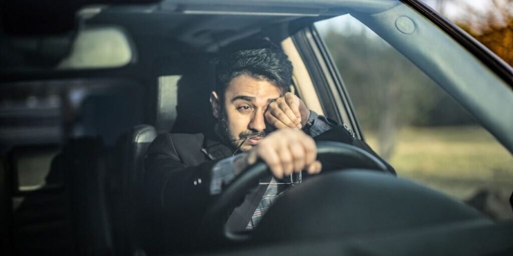 tired-guy-driving-his-car.2110281651550-2